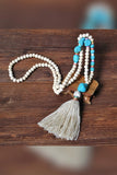 PORTS:  BOHEMIAN TASSEL NECK