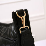 PORTS:  QUILTED SHINY PUFFER XBODY BAG