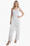 White layered skirt worn by a person on a white background put blonde model in a fittd white tank.
