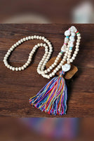 PORTS:  BOHEMIAN TASSEL NECK